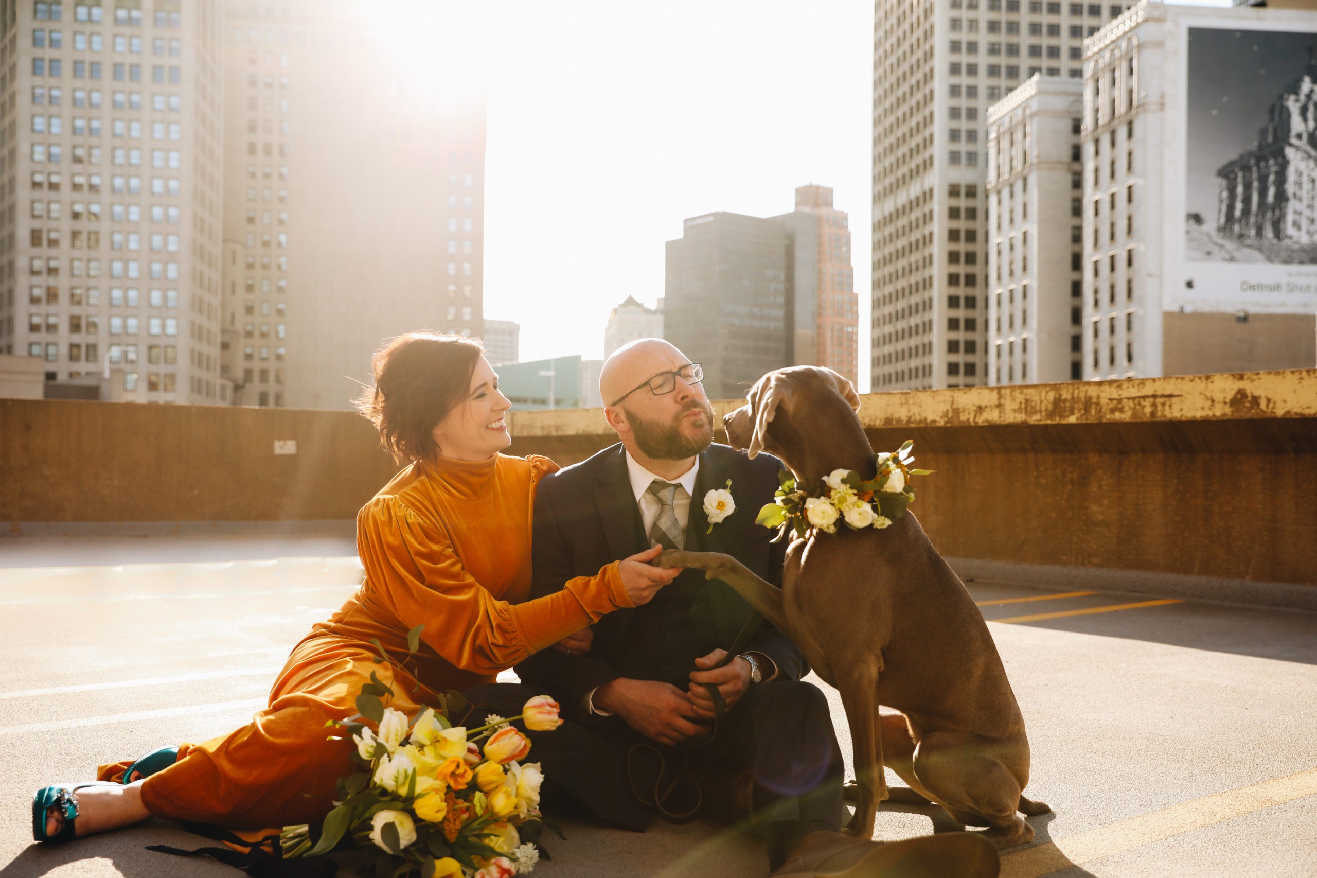 couple on rooftop with their dog